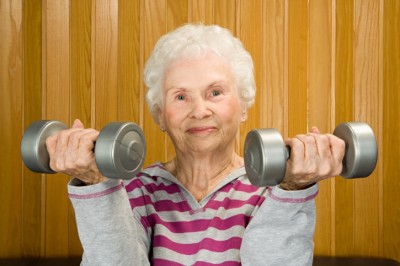 Senior woman lifting dumbbells